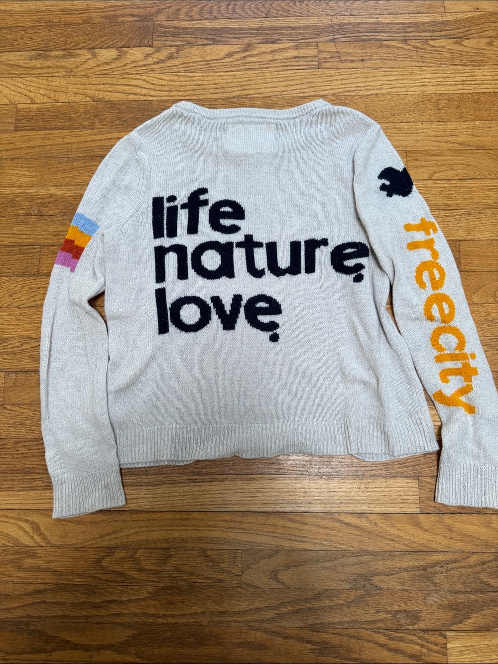 freecity Cream Crewneck Sweater with Black Graphic and Orange Sleeve Logo- Gap